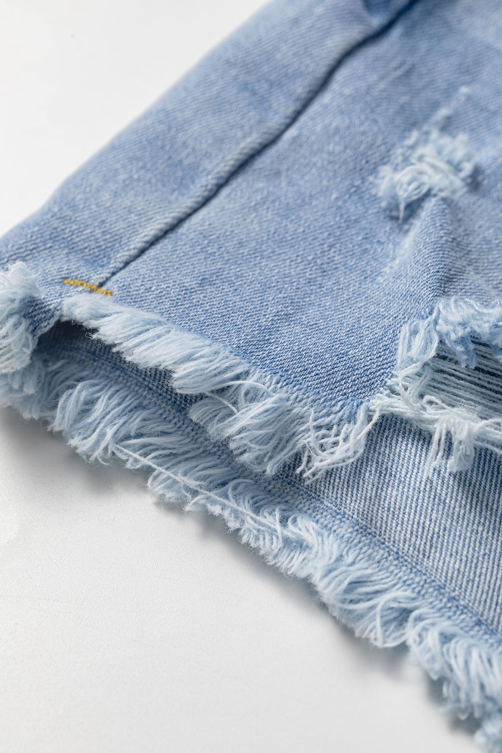 Beau Blue Asymmetric Raw Hem Distressed Whiskery Denim Shorts