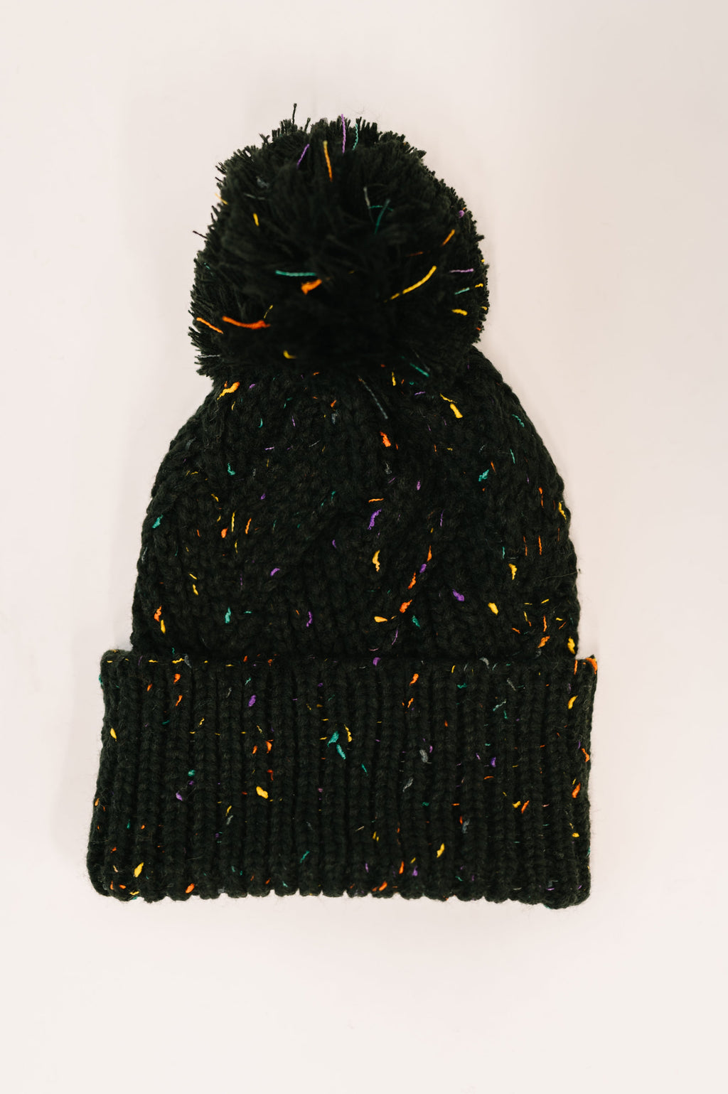 Cover Your Ears Pom Pom Beanie in Black