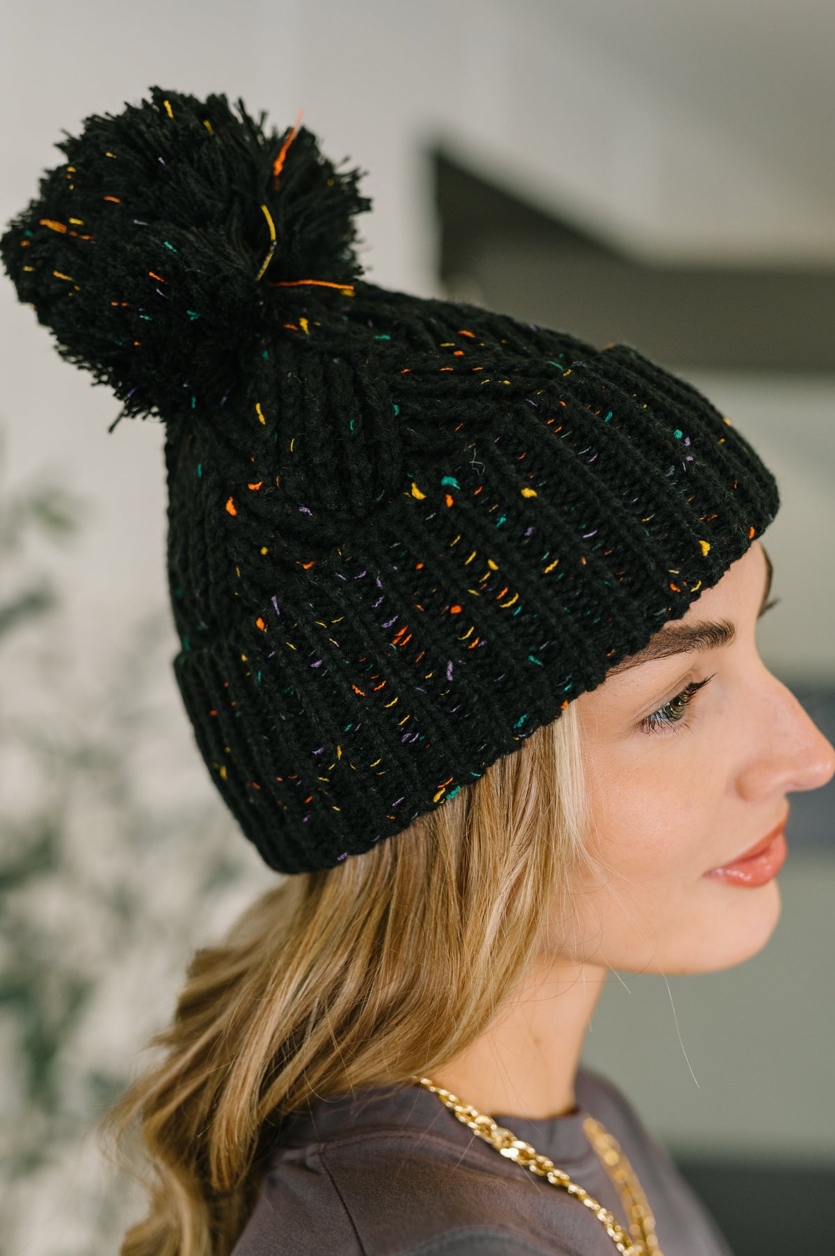 Cover Your Ears Pom Pom Beanie in Black